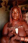 Portrait of Himba Woman Breastfeeding Baby, Opuwo, Namibia