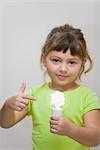 Little Girl Holding Energy Efficient Lightbulb