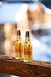 Beer Bottles on Wooden Railing