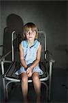 Little Girl Sitting in Lawn Chair