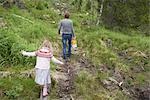 Mother and Daughter Hiking on Path