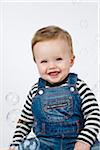 Portrait of Baby Boy Surrounded by Bubbles