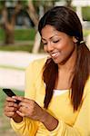 woman looking at phone, smiling