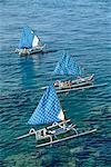 Fishing boats with blue check sails off Cape Jambela on the east coast of the island of Bali, Indonesia, Southeast Asia, Asia