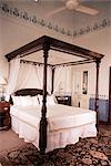 Four poster bed, new hand stenciling work on dado and picture rails in Lutyens style bungalow, New Delhi, India, Asia