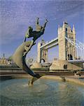 Fountain of child with dolphin and Tower Bridge, London, England, United Kingdom, Europe