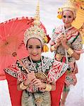 Portrait of two dancers in traditional Thai classical dance costume, smiling and looking at the camera, Bangkok, Thailand, Southeast Asia, Asia