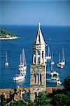 Church spire and boats in the harbour, Hvar Town, Hvar Island, Dalmatia, Dalmatian coast, Croatia, Europe