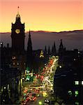 Aerial view over Princes Street at dusk, including the silhouetted Waverley Hotel clock tower, Edinburgh, Lothian, Scotland, United Kingdom, Europe