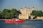 Sightseeing boat on the River Thames, and the Tower of London, UNESCO World Heritage Site, London, England, United Kingdom, Europe