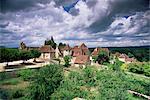 The village amidst the verdant surroundings of the Dordogne valley, Carennac, Lot, Midi-Pyrenees, France, Europe