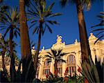 The Casino framed by flowers and palm trees in Monte Carlo, Monaco, Europe