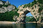 The Pont d'Arc, a natural rock arch over the Ardeche River, in the Ardeche Gorges, in the Ardeche region of the Rhone Alpes, France, Europe