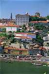 The Ribeira district on the waterfront of the Douro River, with the white facade of the Bishops Palace above, in the centre of Oporto, Portugal, Europe