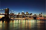 Brooklyn Bridge and Manhattan skyline at dusk, New York City, New York, United States of America, North America