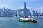 Star Ferry crossing Victoria Harbour towards Hong Kong Island, with Central skyline beyond, Hong Kong, China, Asia