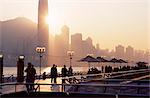 Avenue of Stars, Tsim Sha Tsui, Kowloon, with Victoria Harbour and skyline of Hong Kong Island in the background at dusk, Hong Kong, China, Asia