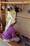 Woman weaving in a village carpet cooperative, using natural organic and vegetable dyes, at Mumcular, Anatolia, Turkey, Asia Minor, Eurasia