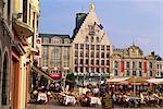 Pavement cafes and old buildings on the Grand Place in the city of Lille, Nord Pas de Calais, France, Europe