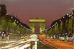 Avenue des Champs Elysees and the Arc de Triomphe at night, Paris, France, Europe