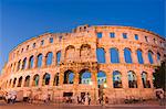 The 1st century Roman amphitheatre bathed in early evening light, Pula, Istria Coast, Croatia, Europe