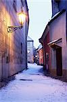 Snow covered 16th century cottages on Golden Lane (Zlata ulicka) in winter twilight, Hradcany, Prague, Czech Republic, Europe