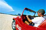 Driving dune buggy on sand dunes, Pitangui, Natal, Rio Grande do Norte state, Brazil, South America