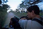 Adventure travel, the road to Rio Dulce from the back of a truck, Guatemala, Central America