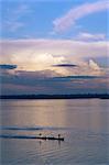 Small fishing boat moving down giant river, Amazon River, Peru, South America