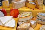 Assorted French cheeses on a market stall, La Flotte, Ile de Re, Charente-Maritime, France, Europe