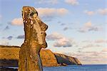 Lone monolithic giant stone Moai statue looking out to sea at Tongariki, Rapa Nui (Easter Island), UNESCO World Heritage Site, Chile, South America