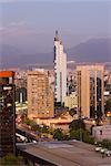 City skyline and the Andes mountains at dusk, Santiago, Chile, South America