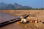 Woman panning for gold in the Mekong River, at Pak Ou, Laos, Indochina, Southeast Asia, Asia