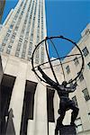 Rockefeller Center, New York City, 1932 - 1940. Atlas Statue by Lee Lowrie and Rene Chambellan, 1937. Architect: Raymond Hood