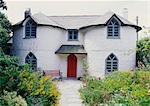 Cottage c.1790s; Picturesque features: gothick windows and circular bays, Regency style, summer garden. Philleigh, Cornwall.