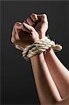 Female hands tied together