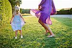 Girl and woman dancing,  outdoors