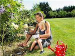 Woman and girl gardening