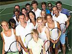 Group of people on tennis court