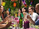 People sitting at table,  celebrating