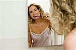 Woman brushing teeth