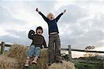 Young boys on hay bales