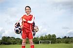 Footballer with bag of balls