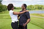 Couple Embracing on Golf Course