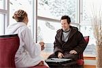 Couple in Bathrobes Playing Backgammon