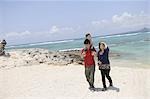 Asian family Enjoying on beach