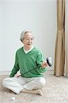 Japanese senior man holding putter