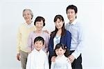 Asian family standing together