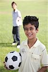 Portrait of a boy holding a football