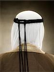 Rear view of a muslim man